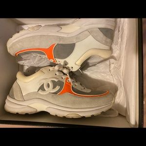Orange and white Chanel sneakers